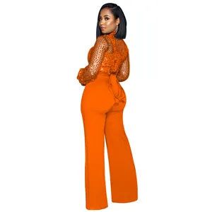 Vue arrière d'une combinaison orange en tulle pailleté avec une taille nouée
