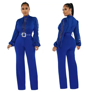 Royal blue long sleeve jumpsuit with lace hollow out detail and belt, front and back view