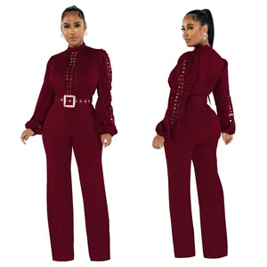 Front and back view of burgundy lace jumpsuit showing hollow-out sleeve detail