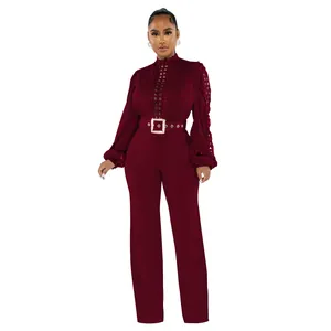Elegant burgundy long sleeve jumpsuit with lace hollow out detailing and waist belt