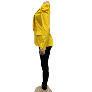 Side profile of a vibrant yellow pleated long-sleeve blazer shown on a mannequin