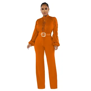 Elegant orange long sleeve hollow lace jumpsuit featuring a stylish waist belt detail