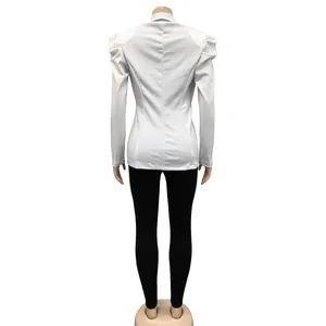 Back view of white women's blazer with elegant puffed shoulders and slim fit design