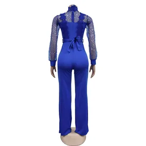 Combinaison bleu roi à lacets avec manches longues transparentes à paillettes et col