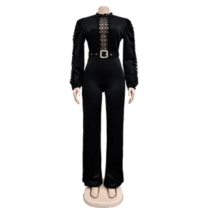 Detailed view of black long sleeve jumpsuit featuring elegant lace and gold buckle belt