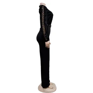 Elegant black jumpsuit featuring intricate lace hollow-out sleeves and a belted waist.