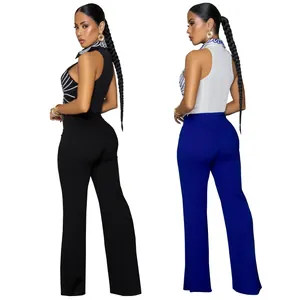 Back view of elegant women's two-piece set with printed top and solid color trousers