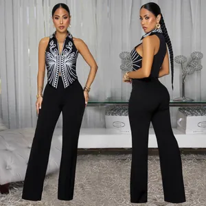 Elegant two-piece set featuring an embroidered halter top and black wide-leg trousers