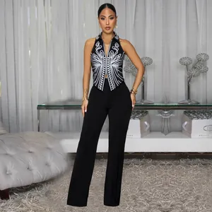 Fashionable women's two-piece set featuring embroidered halter top and wide-leg pants