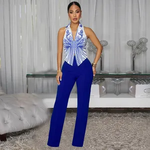 Elegant two-piece set featuring a blue embroidered halter top and royal blue trousers.