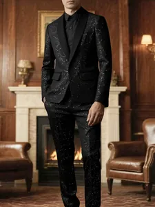 A stylish men's black sparkly banquet tuxedo suit set worn in a luxury setting