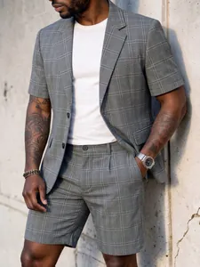 Detail view of men's grey plaid short-sleeve suit set for summer business casual look