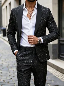 Close-up view of a stylish black slim-fit suit featuring unique white splatter print