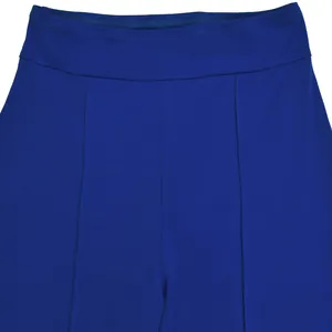 Detailed macro view of royal blue high-waist trousers featuring precise seam stitching