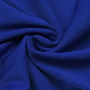 Macro detail of elegant royal blue fabric with fine textured weave and soft drape