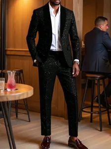 Black sparkling suit set presented in a stylish lounge setting for party events.