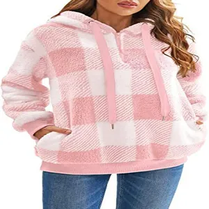 Detailed view of the soft pink and white checkered fleece texture on this hooded jacket