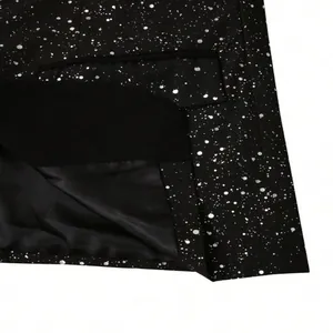 Close-up of sparkling black men's suit fabric with starry pattern and black lining