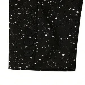 Detailed close-up of a black suit sleeve with silver speckle pattern and three buttons