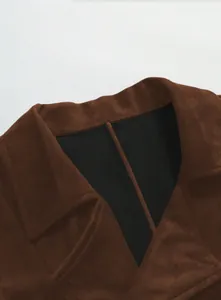 Detail of brown faux suede waistcoat with notched lapel and black lining
