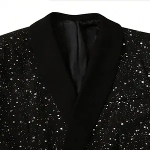 Detailed macro view of black men's formal blazer with shimmering silver starry pattern