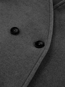 Macro view of textured grey wool fabric and black buttons on double-breasted coat