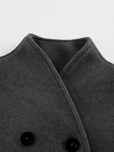 Close-up detail of gray woolen double-breasted coat collar and elegant black buttons
