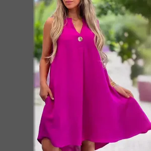 Vibrant fuchsia sleeveless V-neck casual summer dress featuring a decorative button and pockets