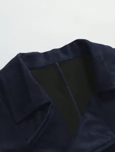 Close-up view of navy blue business vest lapel showing high-quality faux suede fabric.