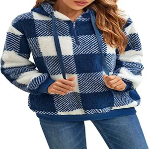 Close-up detail showing blue and white checkered fluffy fleece texture on hooded jacket