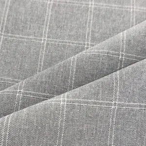 Macro detail of premium grey plaid suit fabric showing high-quality woven texture