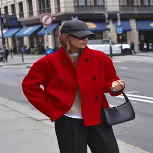 Elegant red double-breasted woolen coat for women presented in a chic street style look