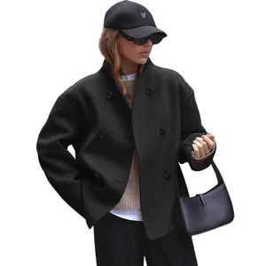 Stylish women's double-breasted black wool coat in minimalist British style for autumn