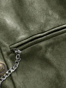 Detail view of the pocket and metallic chain on an olive green suede business vest