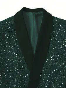 Detail view of shiny dark green blazer with silver splatter pattern and black lapel