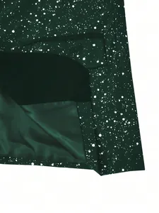Close-up of dark green men's suit jacket with white speckle pattern and pocket detail.