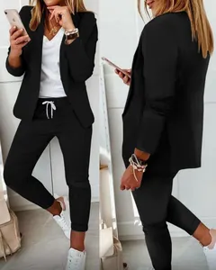 Front and back detail of a black casual blazer suit set for women with drawstring pants