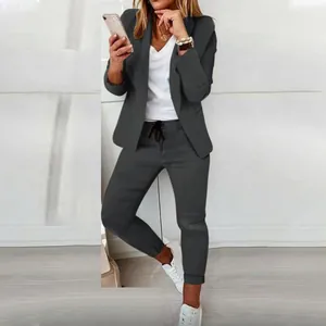 Stylish women's two-piece casual blazer and drawstring pants set in charcoal grey color