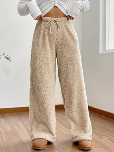 Detail view of women's beige fuzzy fleece high-waisted wide-leg lounge pants.