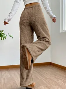 Detailed view of high-waisted brown plush lounge pants featuring a soft fleece texture