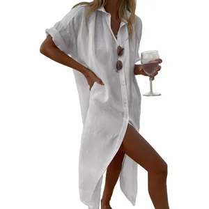 Detailed view of a white linen button-down shirt dress, ideal for casual beach cover-up wear