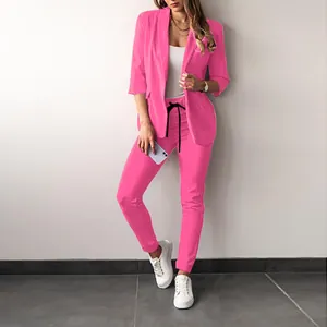 Elegant women's vibrant pink two-piece casual blazer and slim fit trousers set suit