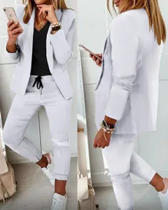 Detail view showing front and side of women's casual white two-piece blazer set