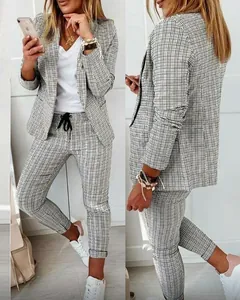 Women's plaid blazer and pants set for professional and casual office style outfit.