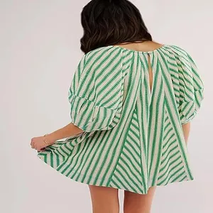 Back view of a green and white striped loose short sleeve summer romper
