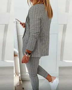 Women's grey plaid two-piece suit with blazer and slim trousers for casual office wear