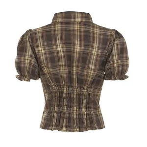 Back view of retro brown plaid puff sleeve shirt with smocked waist detail