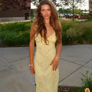 Summer vintage floral slip dress with a low-cut neckline and slim fit for a vacation look