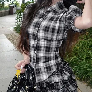 Close-up detail of vintage plaid puff sleeve shirt with slim-fit turn-down collar