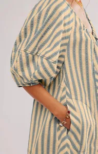 Detail shot of striped summer jumpsuit with short puff sleeves and side pockets